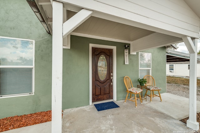 doorway to property with a patio