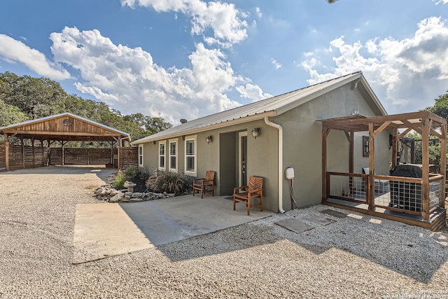 view of front of home featuring a carport