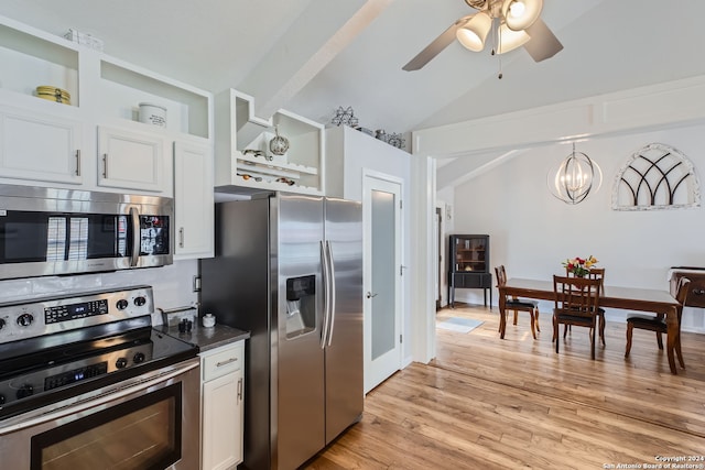 kitchen with appliances with stainless steel finishes, lofted ceiling, white cabinets, and light wood-type flooring