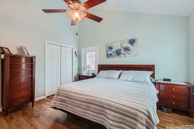 bedroom with a closet, ceiling fan, lofted ceiling, and dark hardwood / wood-style floors