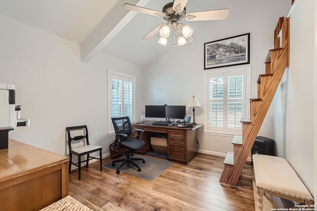 home office featuring ceiling fan, lofted ceiling with beams, and light hardwood / wood-style flooring