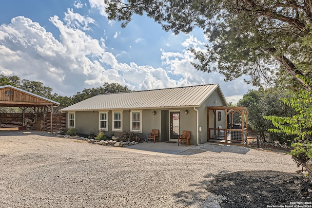 ranch-style house with a carport