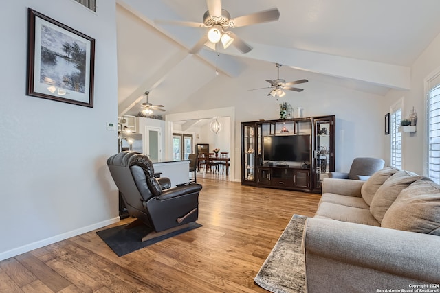 living room with beam ceiling, high vaulted ceiling, light hardwood / wood-style floors, and ceiling fan