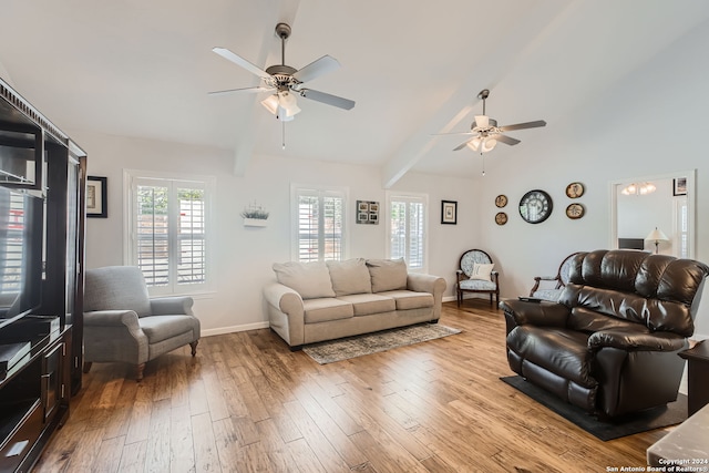 living room with vaulted ceiling, light wood-type flooring, and ceiling fan