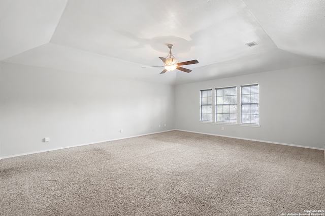 unfurnished room with lofted ceiling, carpet, and ceiling fan