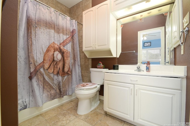 bathroom featuring a ceiling fan, toilet, tile patterned flooring, vanity, and shower / tub combo