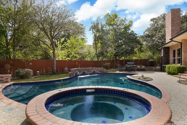 view of pool with a patio area, an in-ground hot tub, and a fenced backyard