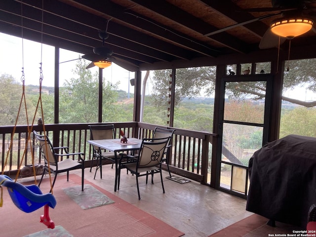 sunroom / solarium with ceiling fan