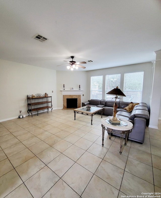 tiled living room featuring ceiling fan