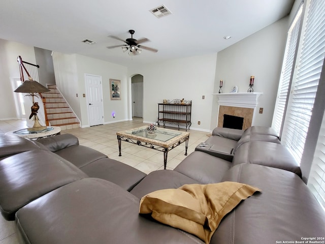 living room with light tile patterned floors and ceiling fan