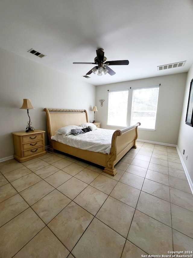 unfurnished bedroom featuring ceiling fan and light tile patterned floors