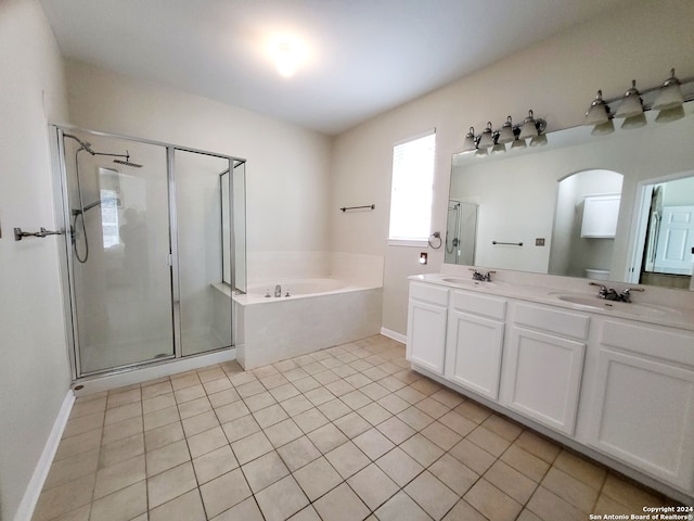 bathroom featuring vanity, tile patterned floors, and plus walk in shower