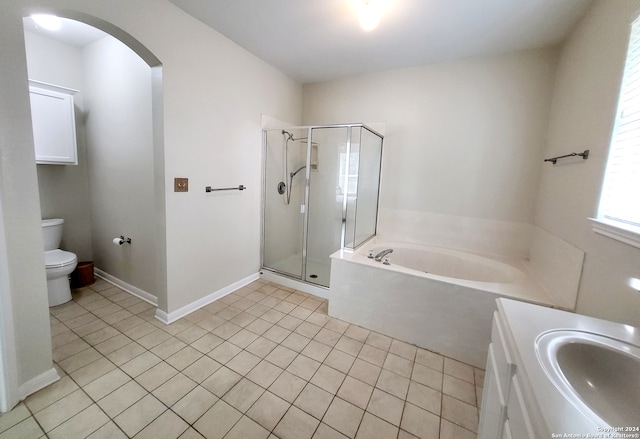 full bathroom with vanity, toilet, shower with separate bathtub, and tile patterned flooring