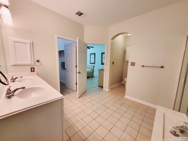 bathroom with vanity, tile patterned floors, and toilet