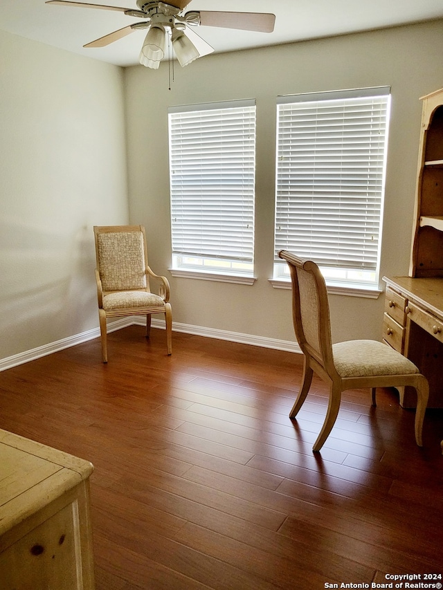 sitting room featuring hardwood / wood-style flooring, ceiling fan, and a wealth of natural light