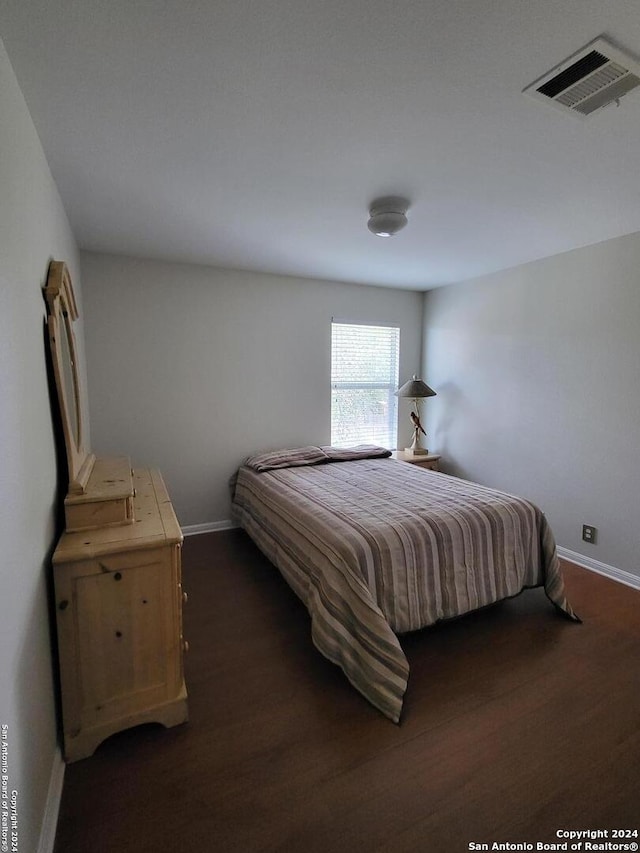 bedroom featuring dark hardwood / wood-style floors