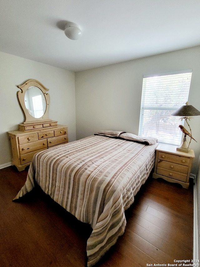 bedroom featuring dark wood-type flooring