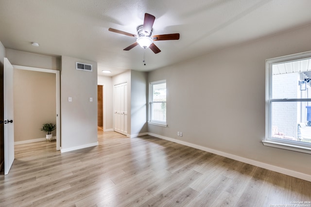 unfurnished bedroom featuring ceiling fan and light hardwood / wood-style flooring