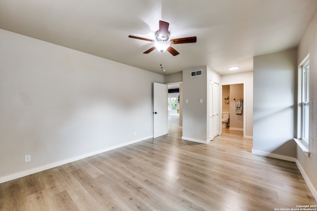 spare room featuring ceiling fan and light wood-type flooring