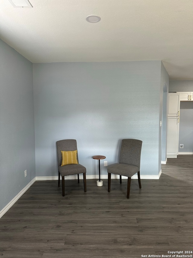 living area featuring dark hardwood / wood-style floors