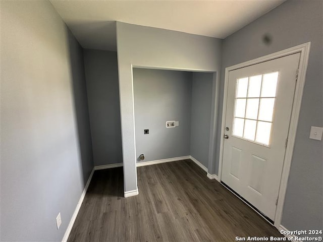 laundry room featuring electric dryer hookup and dark hardwood / wood-style floors