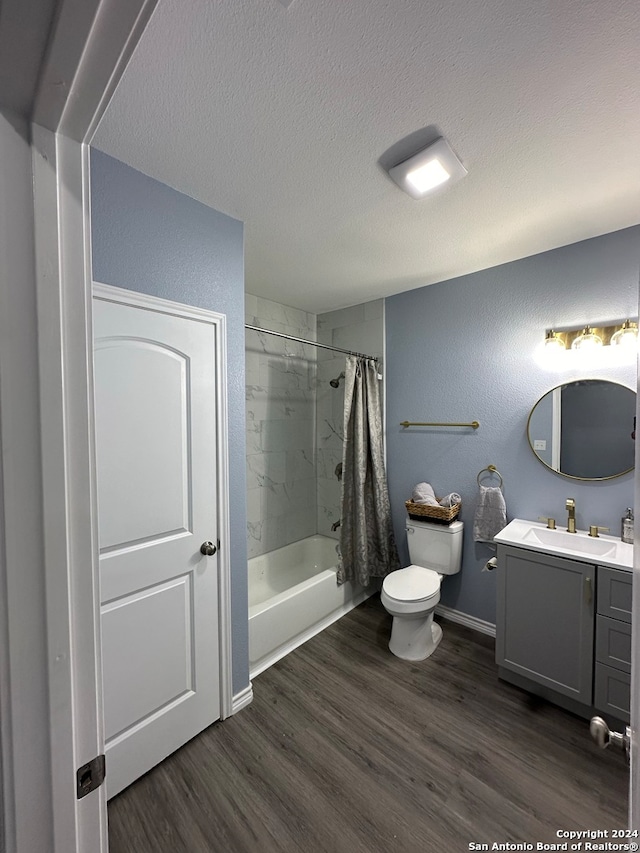 full bathroom with vanity, toilet, shower / tub combo, and hardwood / wood-style floors