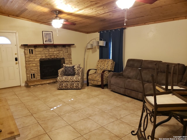 tiled living room featuring wood ceiling, vaulted ceiling, a fireplace, and ceiling fan