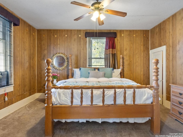 1315 Alametos, San Antonio, TX 78201 - carpeted bedroom featuring wood walls and a ceiling fan