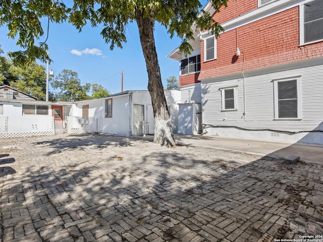 back of house with a patio area