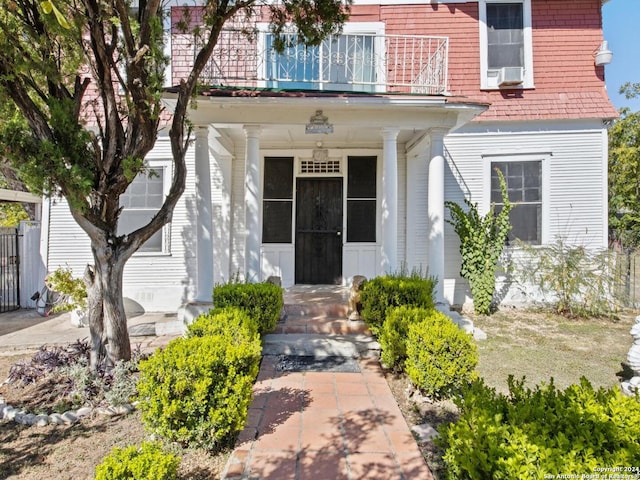 entrance to property featuring a balcony