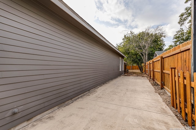 view of side of property with a patio area