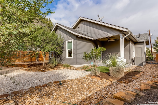 view of side of home with ceiling fan