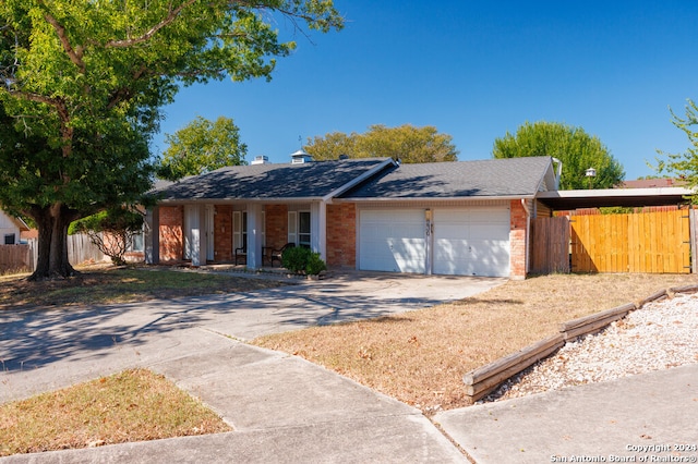 single story home with a garage