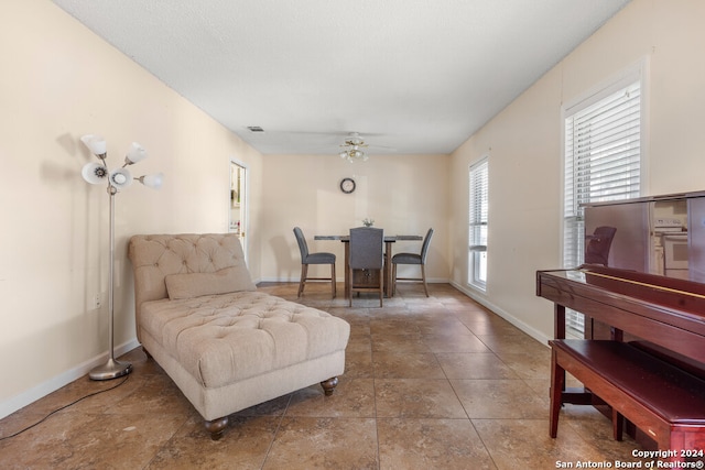 interior space featuring ceiling fan