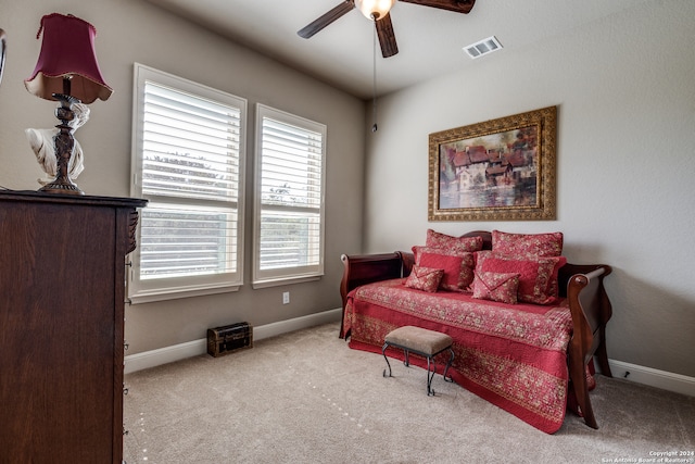 bedroom featuring light carpet and ceiling fan