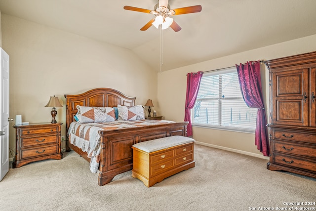 bedroom featuring ceiling fan, lofted ceiling, and light colored carpet