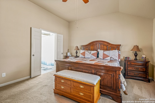 bedroom featuring light carpet, lofted ceiling, and ceiling fan