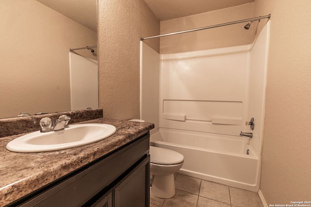 full bathroom with vanity, shower / tub combination, tile patterned flooring, toilet, and a textured ceiling