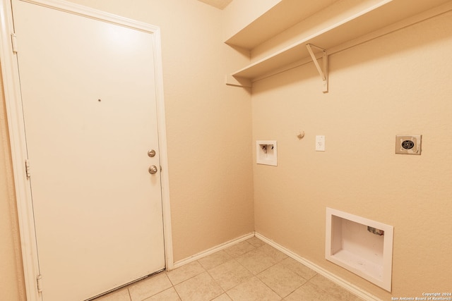 laundry room with gas dryer hookup, light tile patterned flooring, washer hookup, and hookup for an electric dryer