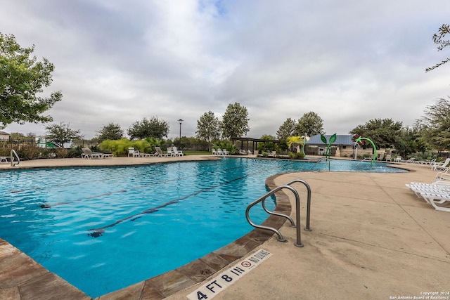 view of swimming pool featuring a patio area