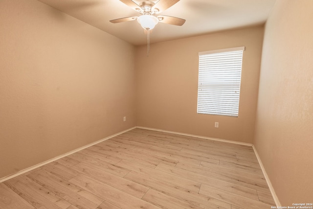 unfurnished room with ceiling fan and light hardwood / wood-style flooring