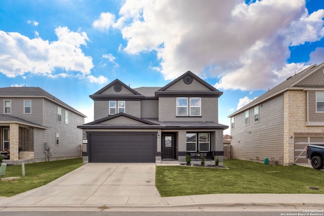 view of property with a front yard and a garage