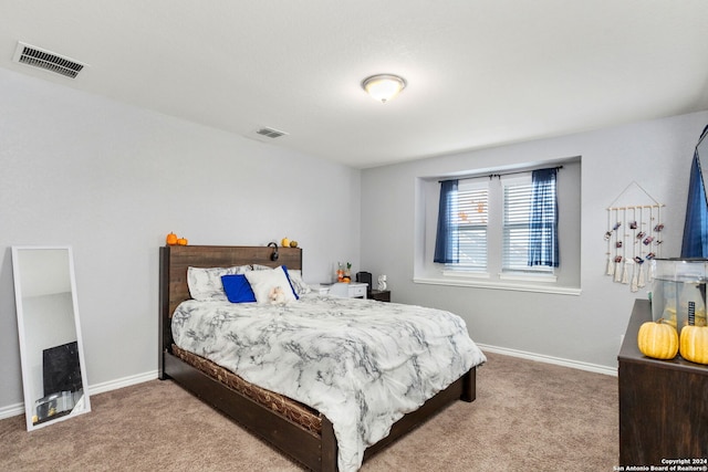 bedroom featuring light colored carpet