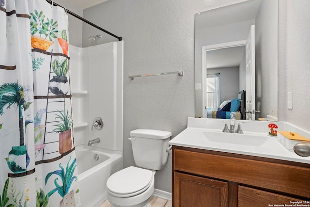 full bathroom with vanity, shower / bath combo, and toilet