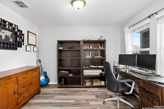 office space featuring light hardwood / wood-style floors