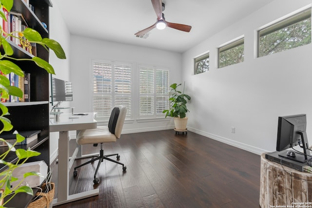 home office featuring dark hardwood / wood-style flooring and ceiling fan