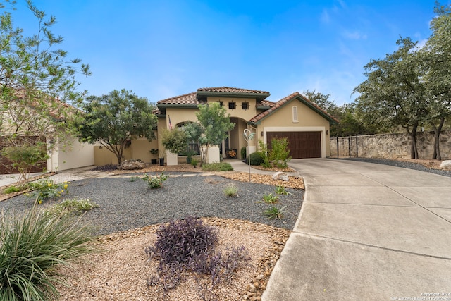 mediterranean / spanish-style house featuring a garage