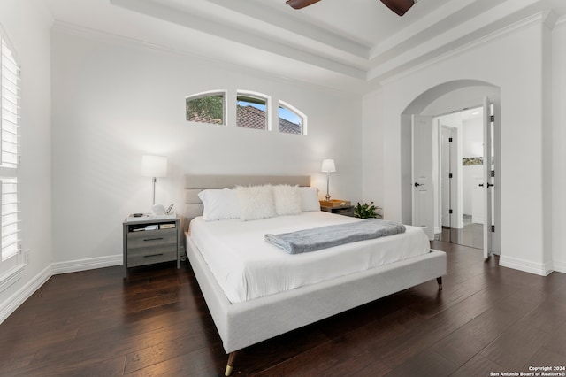 bedroom featuring ceiling fan, dark hardwood / wood-style floors, and crown molding