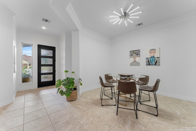 dining room with an inviting chandelier and crown molding