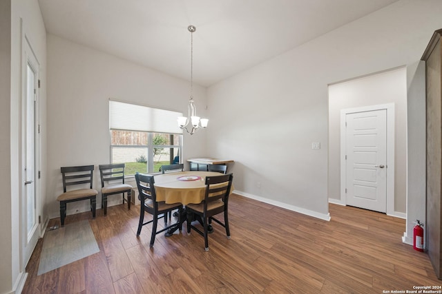 14471 Costa Leon, San Antonio, TX 78245 - dining room with wood finished floors, a chandelier, and baseboards